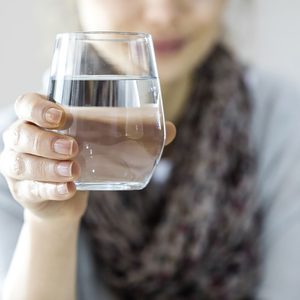 Young woman drinking water