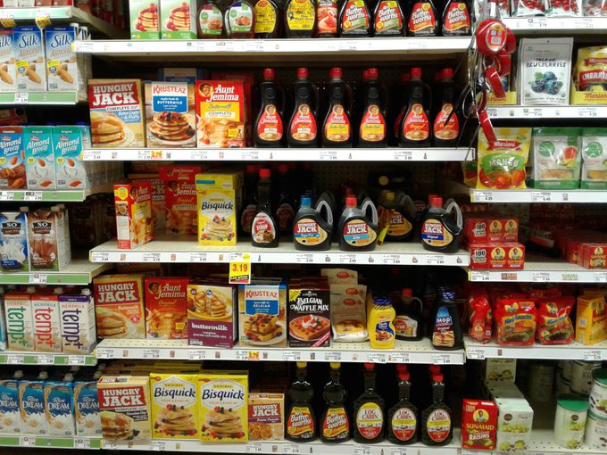 Grocery store shelf of maple syrups