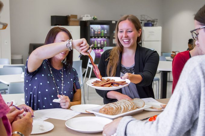 Bacon being passed around the testing table from person to person