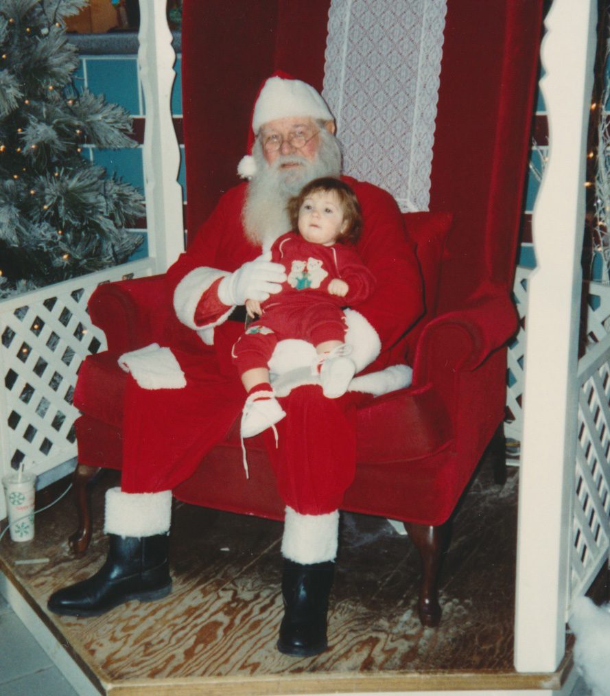 Young child sitting on Santa