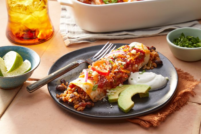 A Plate of Black Bean And Rice Enchiladas