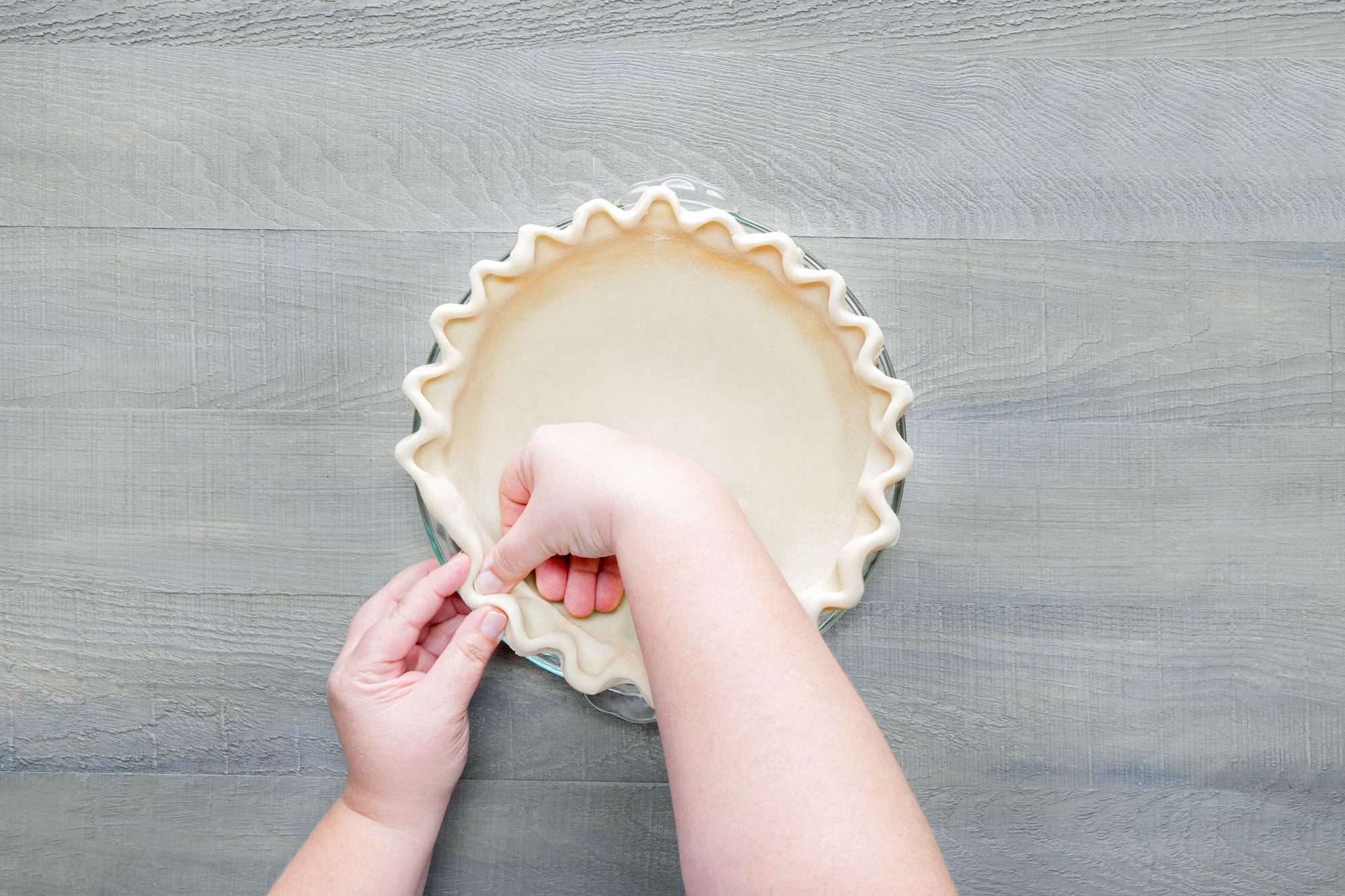 Fit the dough to the plate