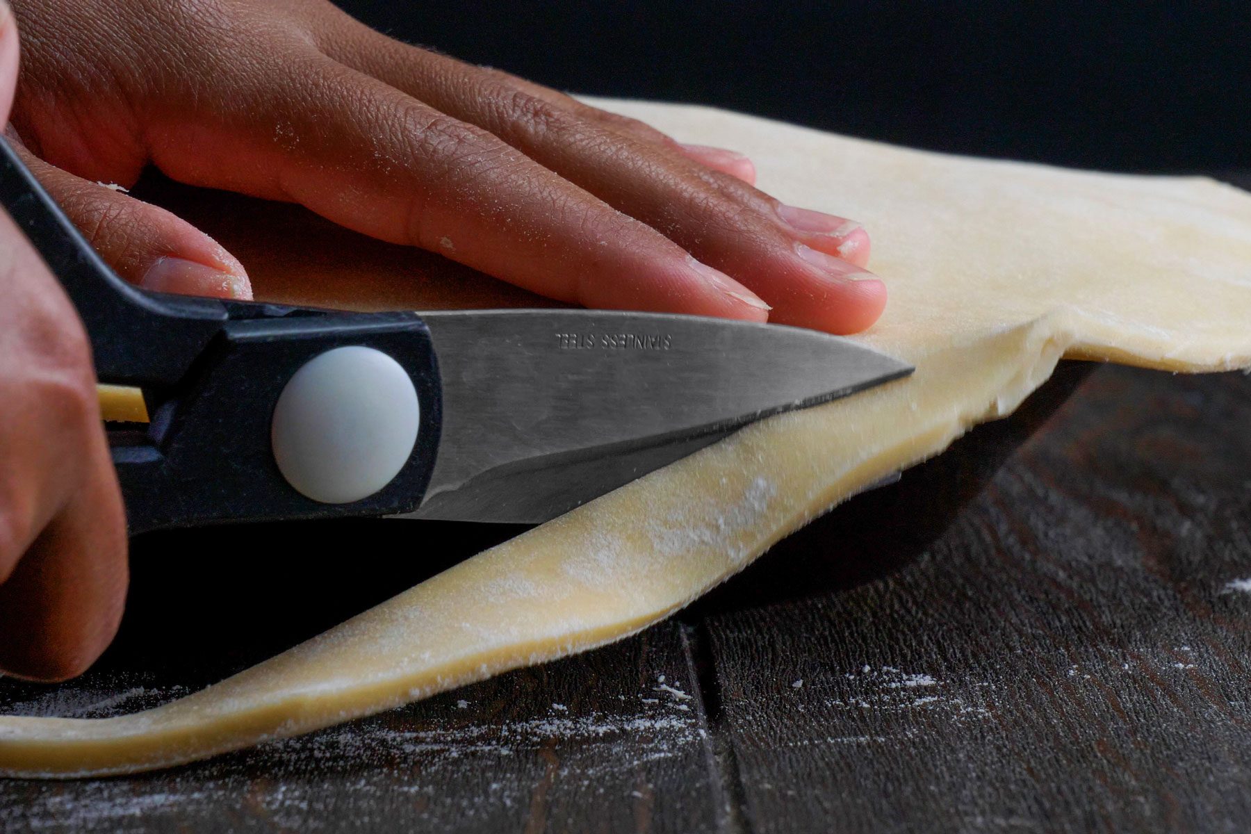 Pie crusts is Trimmed from edges to seal the pie plates