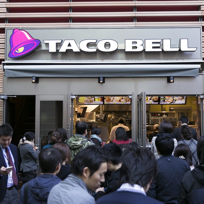 People queue outside new Taco Bell restaurant, Tokyo, Japa