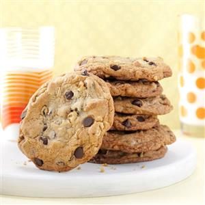 A stack of chocolate chip cookies on a plate.