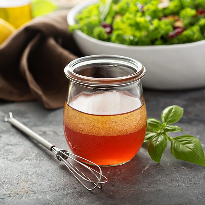 Homemade salad dressing vinaigrette with raspberry and pomegranate juice