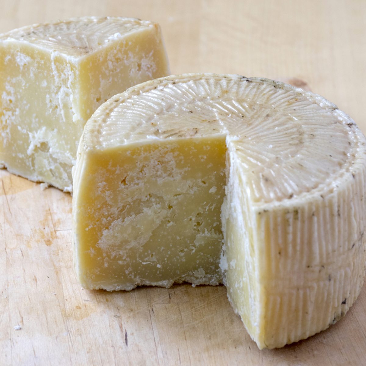Pecorino cheese on wooden table