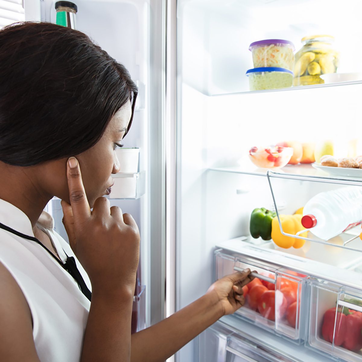 Young Woman Looking In Fridge At Kitchen; Shutterstock ID 762123727; Job (TFH, TOH, RD, BNB, CWM, CM): TOH Amazon Echo