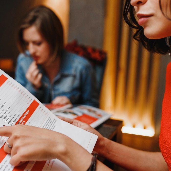 Woman reading menu