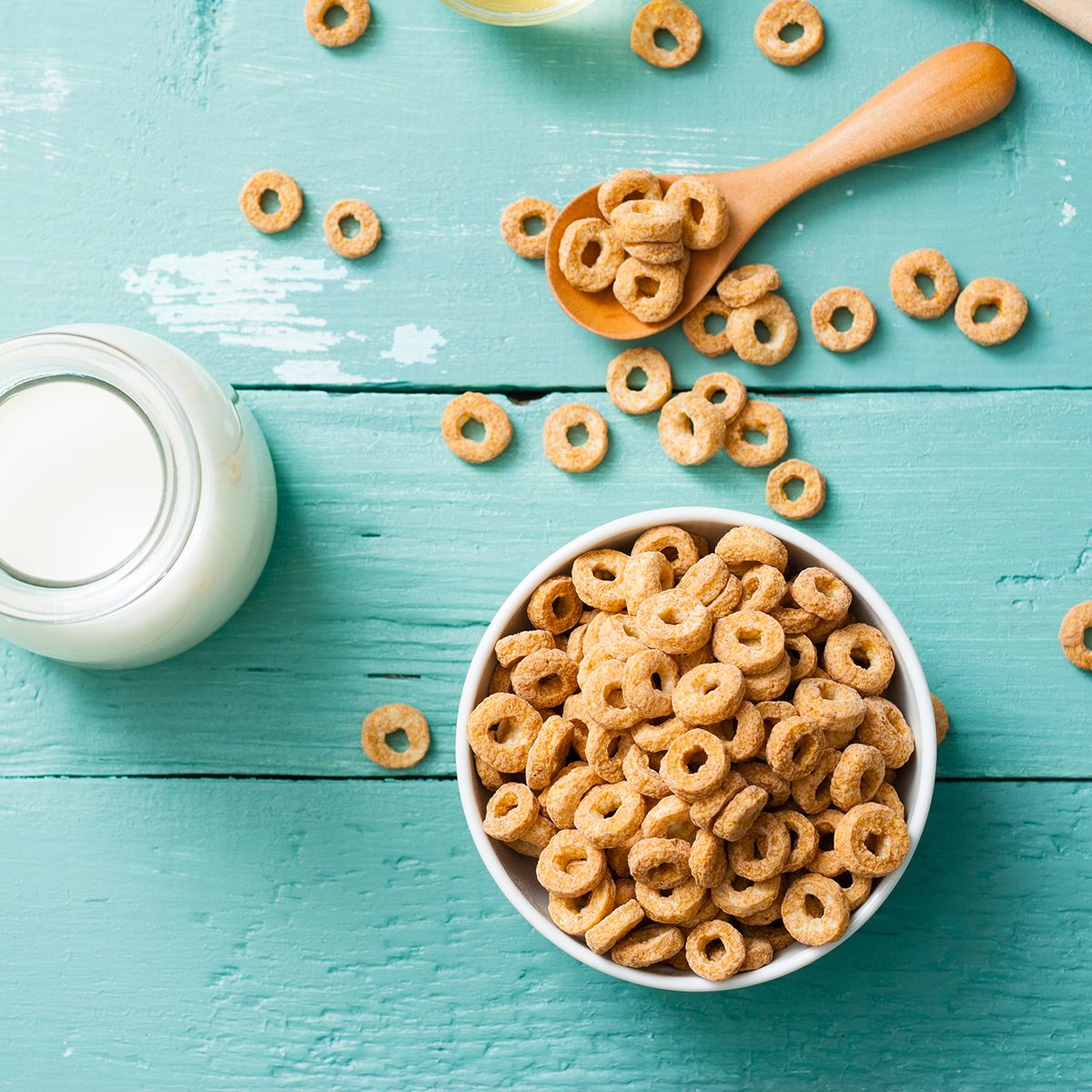 breakfast cereal with milk, honey on blue wood table