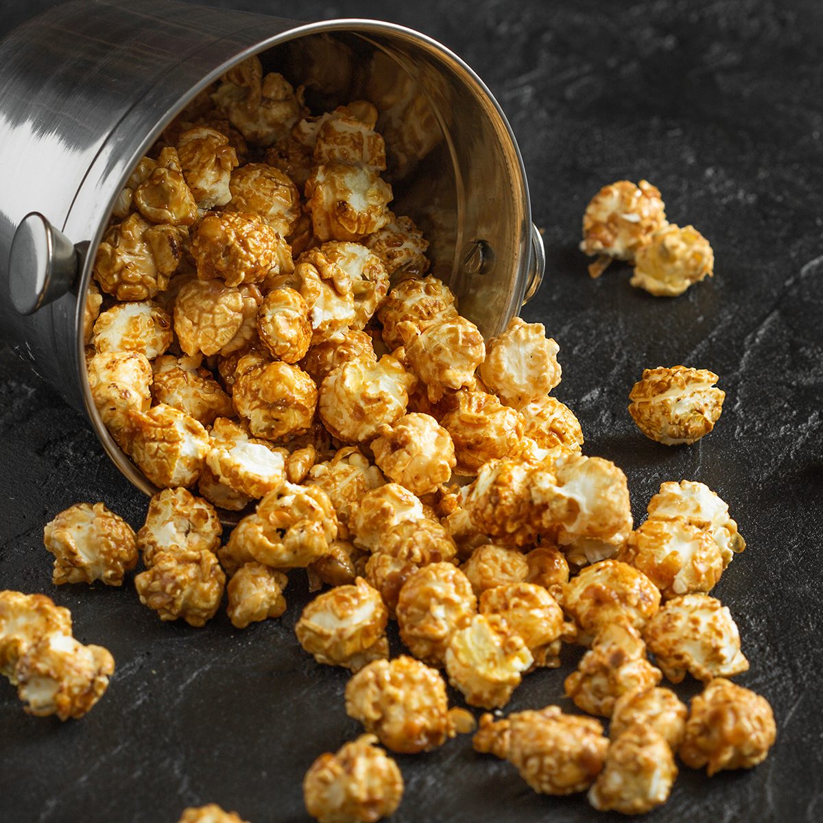 Loose popcorn on a dark background horizontally