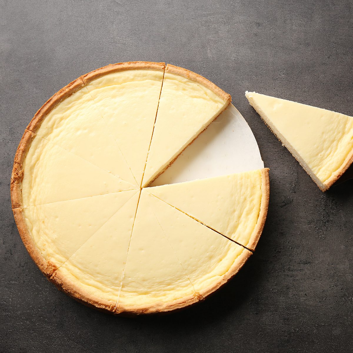 Tasty homemade cheesecake on grey table