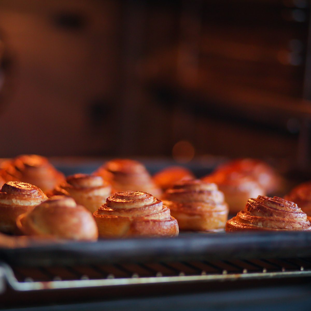 cinnamon rolls are baked in the oven