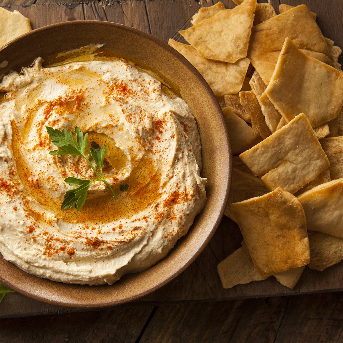 Healthy Homemade Creamy Hummus with Olive Oil and Pita Chips