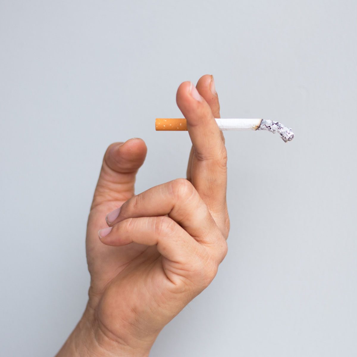 man smoking a cigarette