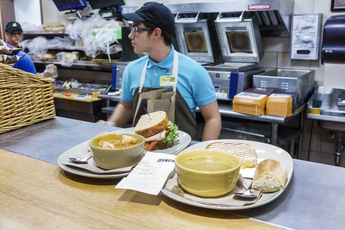 Plates of food on the counter inside Panera Bread.
