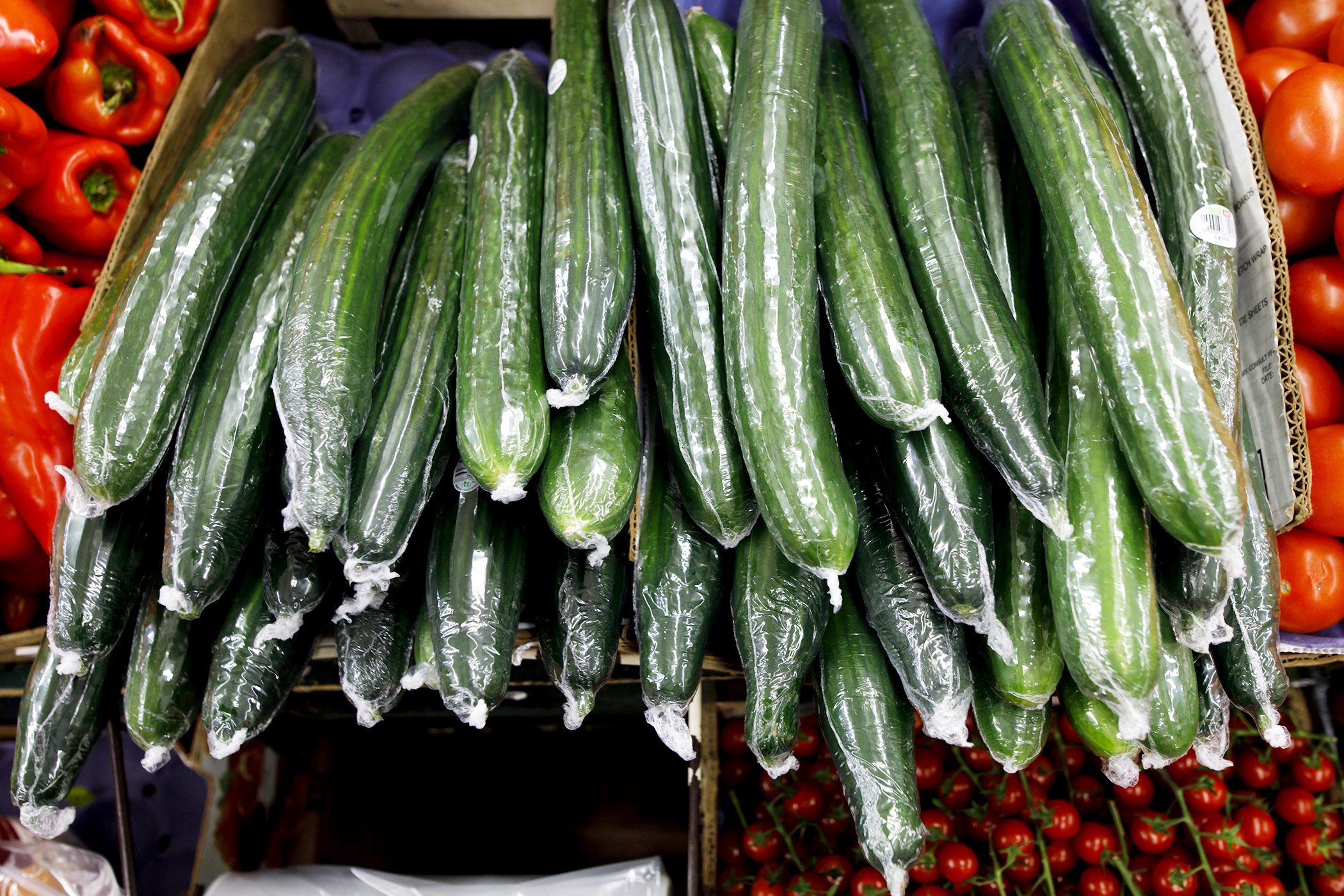 Cucumbers Sit Wrapped In Plastic Film Wrapping