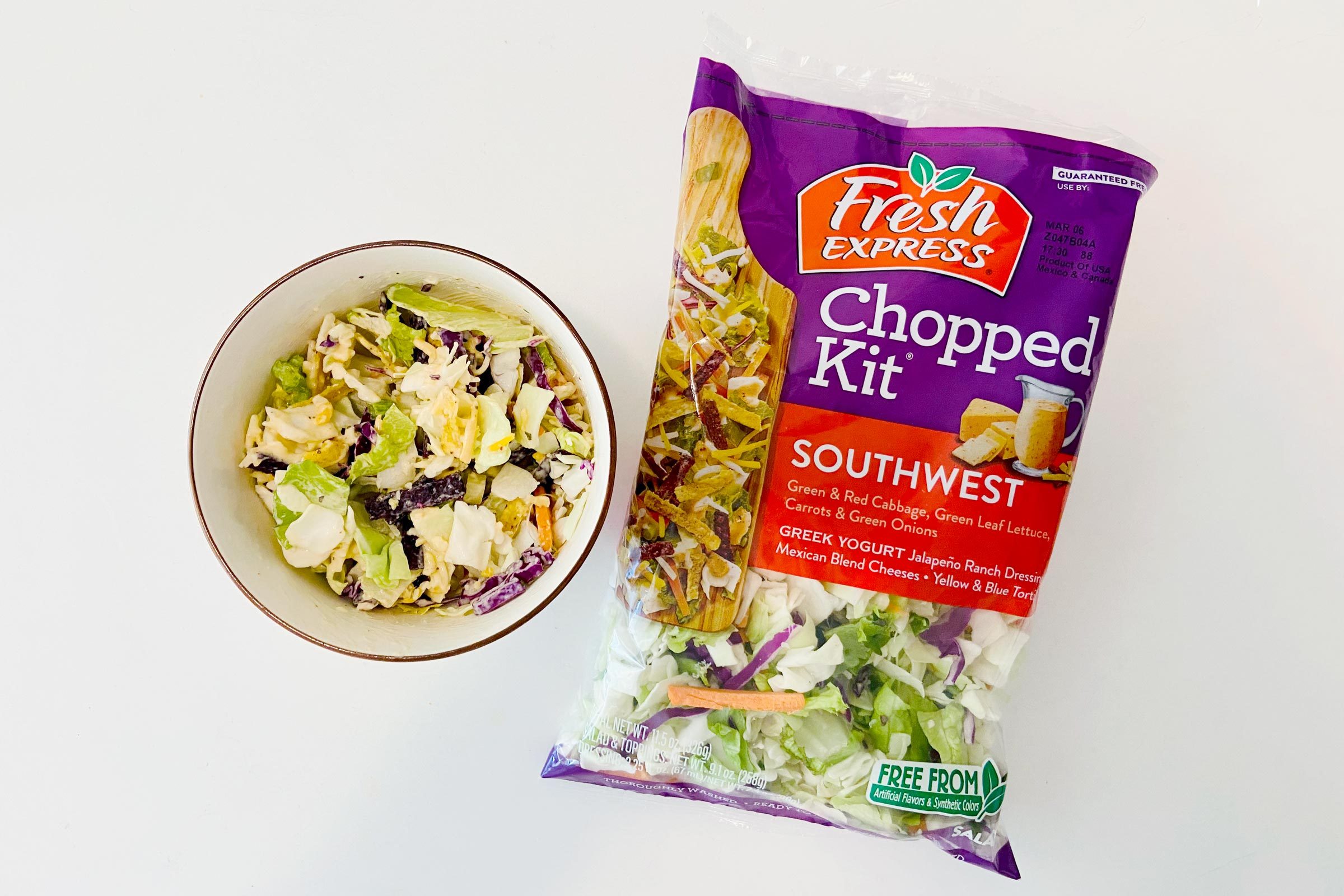 Fresh Express salad bag with a bowl of Salad