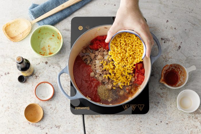 add macaroni to dutch oven