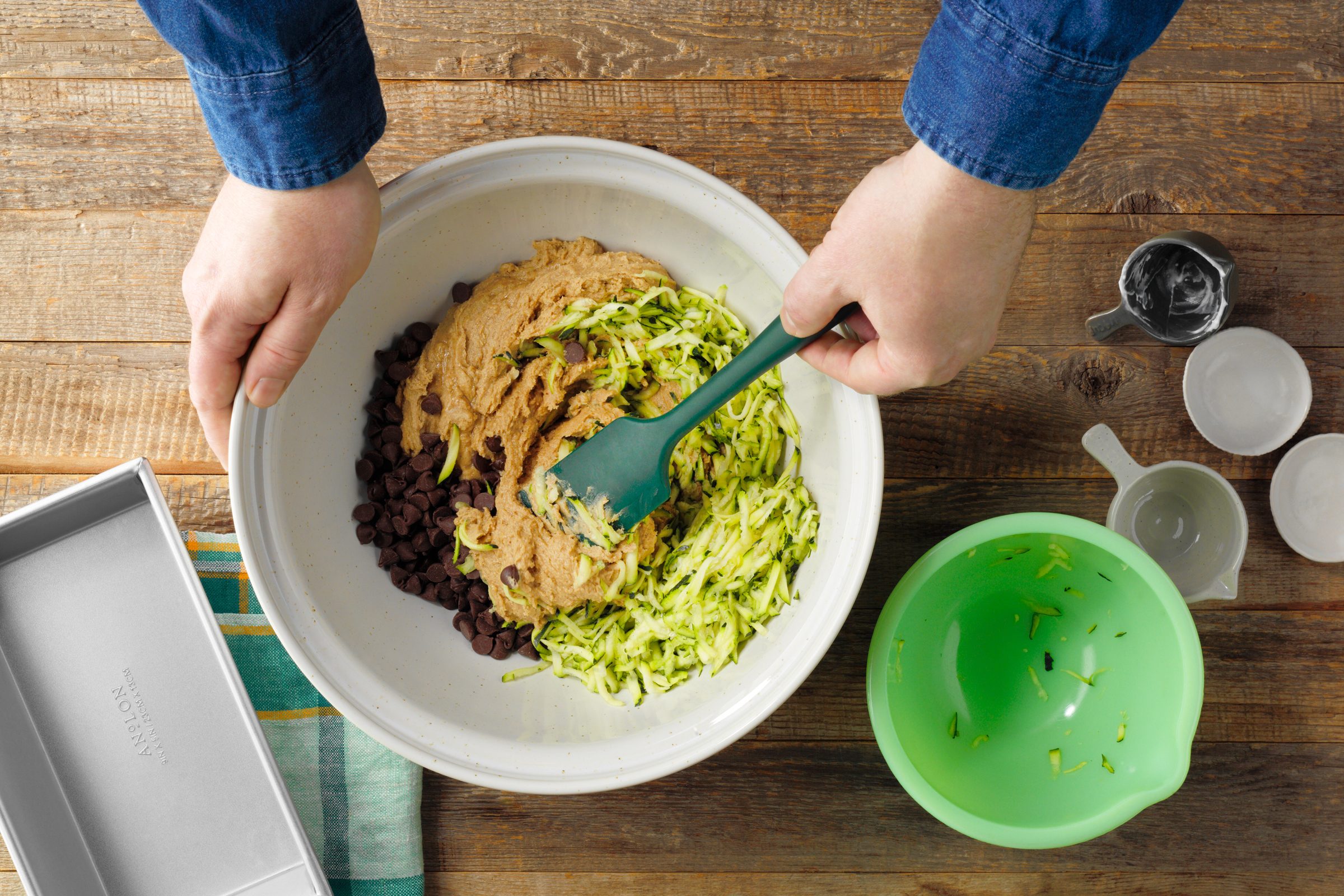 mixing ingredients in a bowl for gluten free zucchini bread, top view