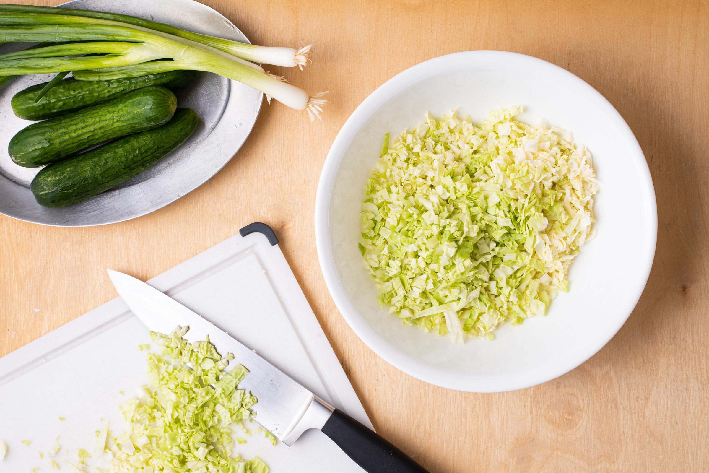 chopping ingredients for Green Goddess Salad 