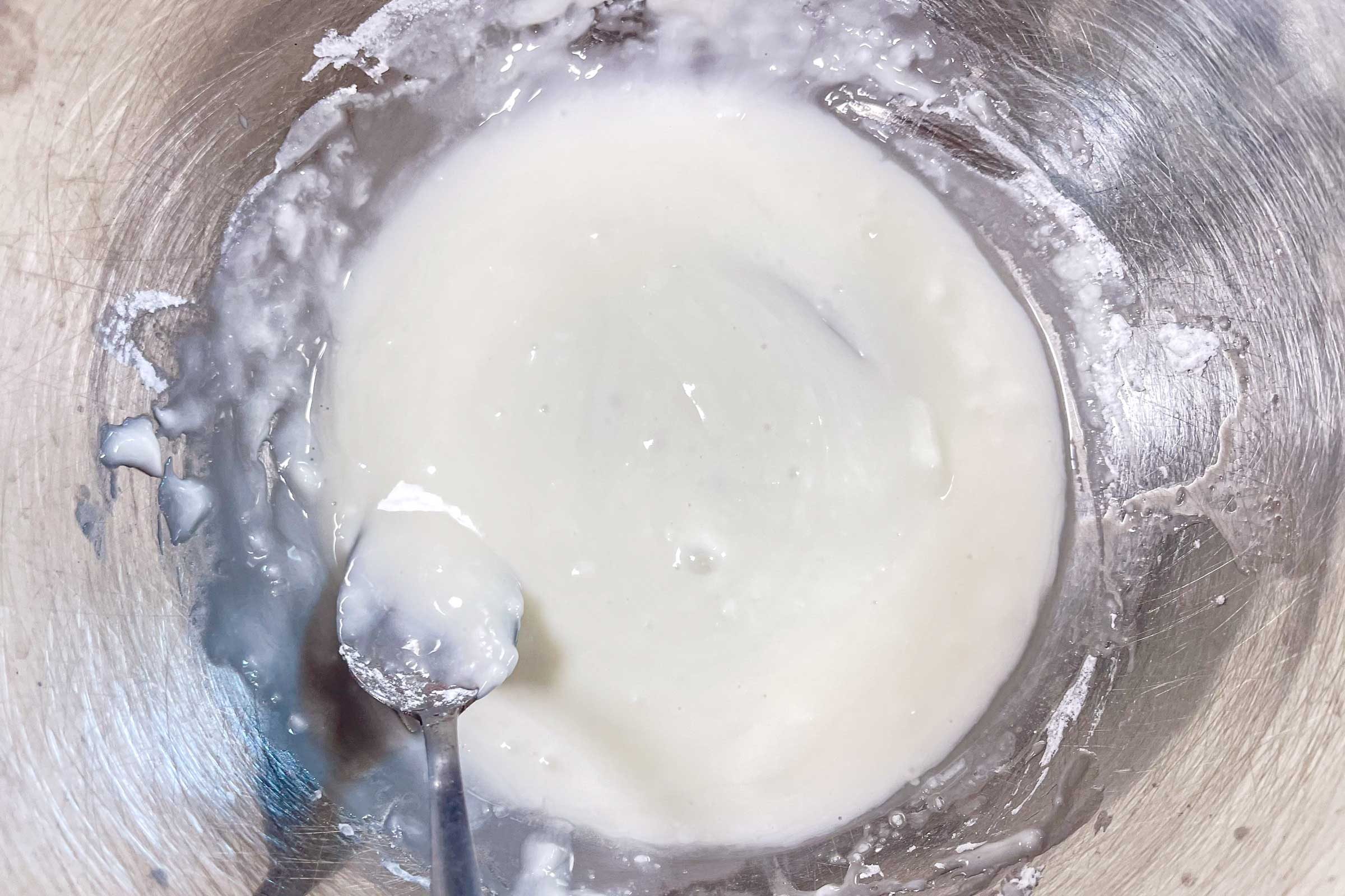 mochi glaze in a metal mixing bowl