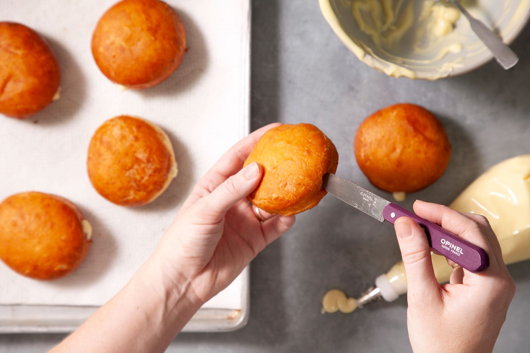 Filling the doughnuts with cream