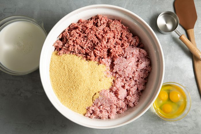 Mixing meat with ingredients