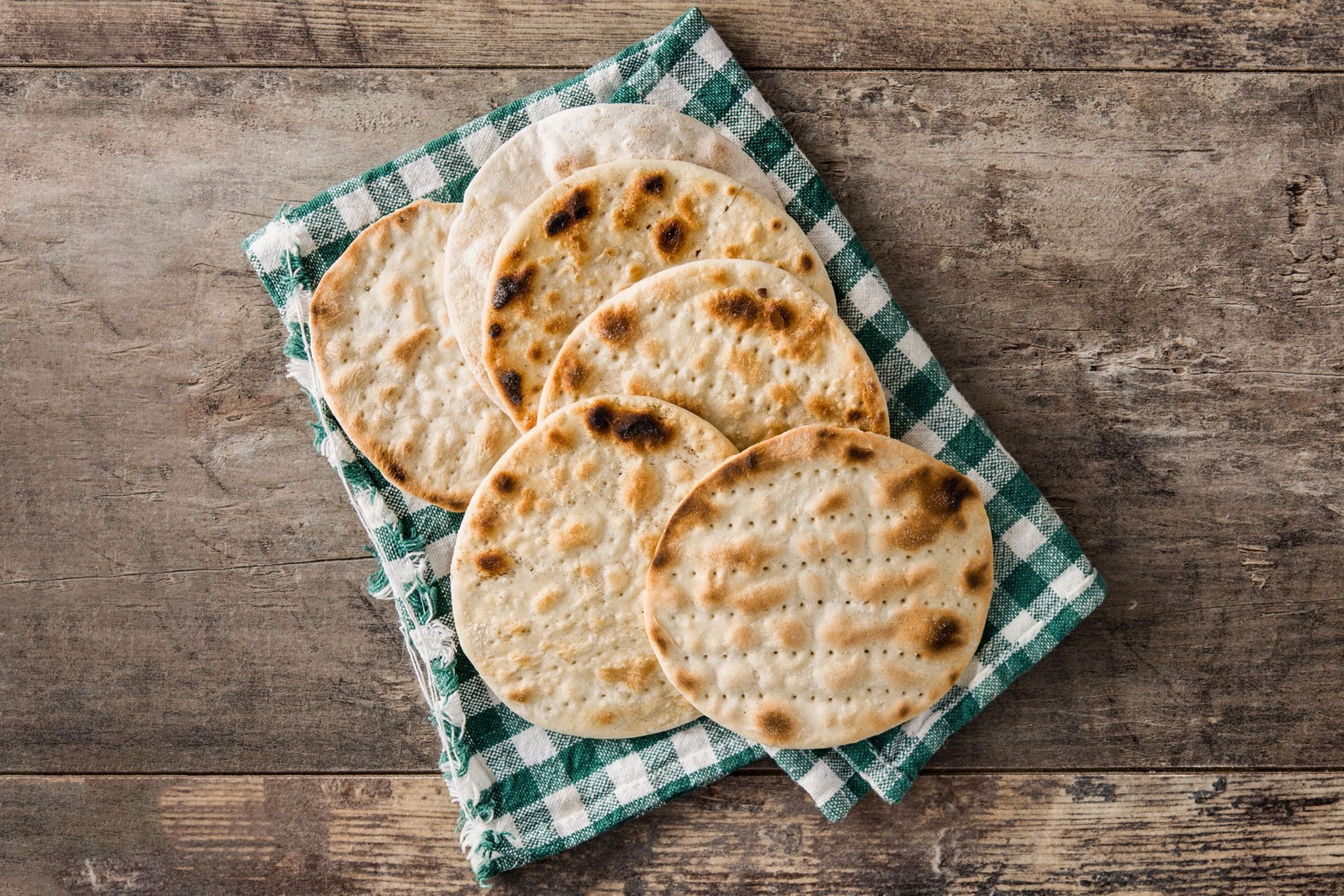 Handmade Matzah Matzo For Jewish Passover On Wooden Table
