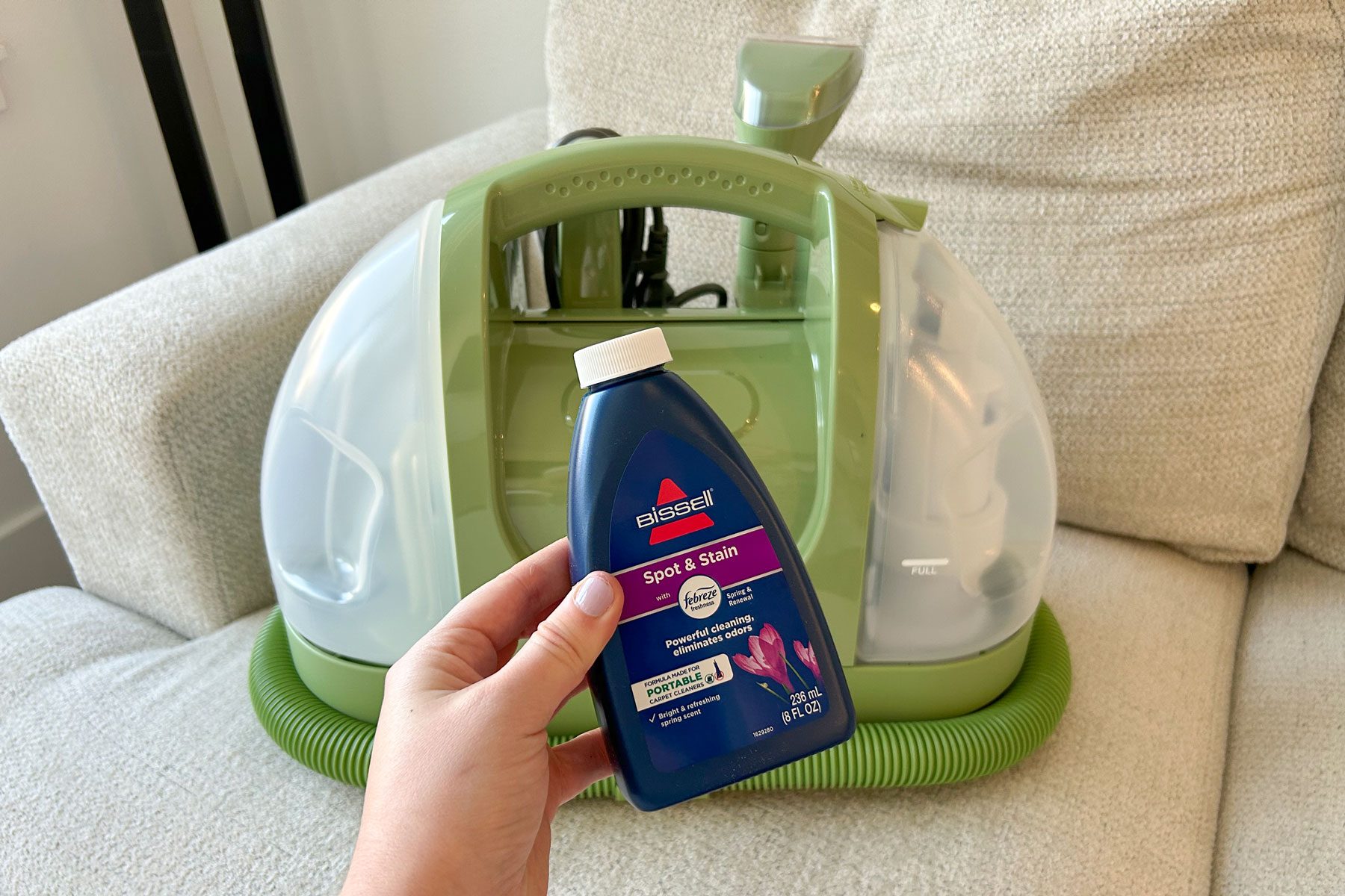 Bissell Little Green Machine with a liquid soap