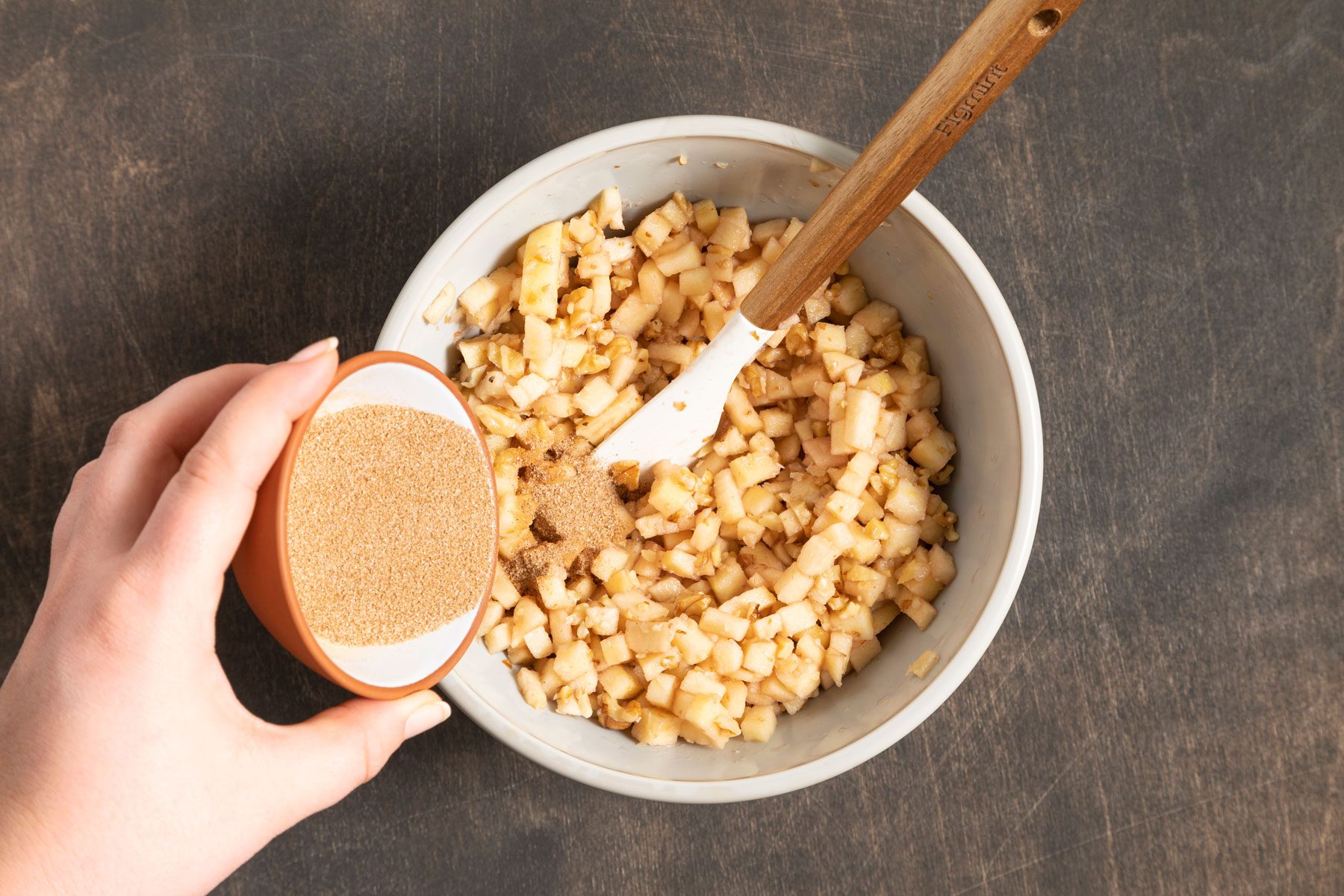 Apples, walnuts and wine in a large bowl