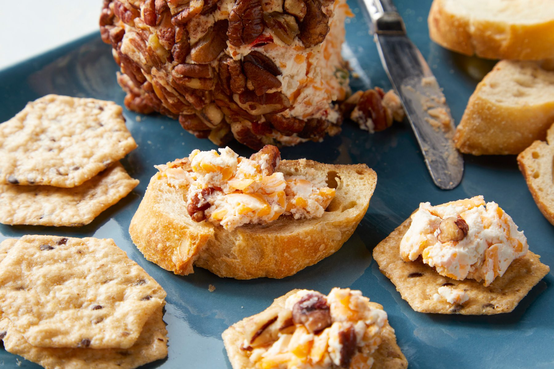 A plate of christmas cheese ball on a table