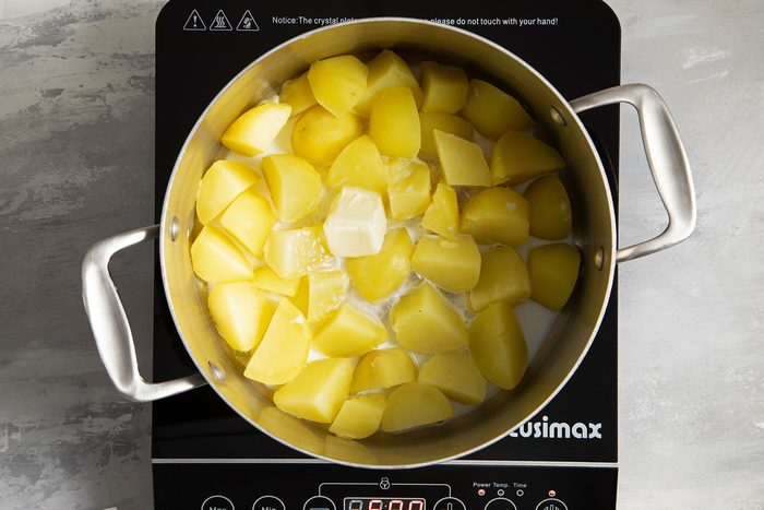 Potatoes cooking in saucepan