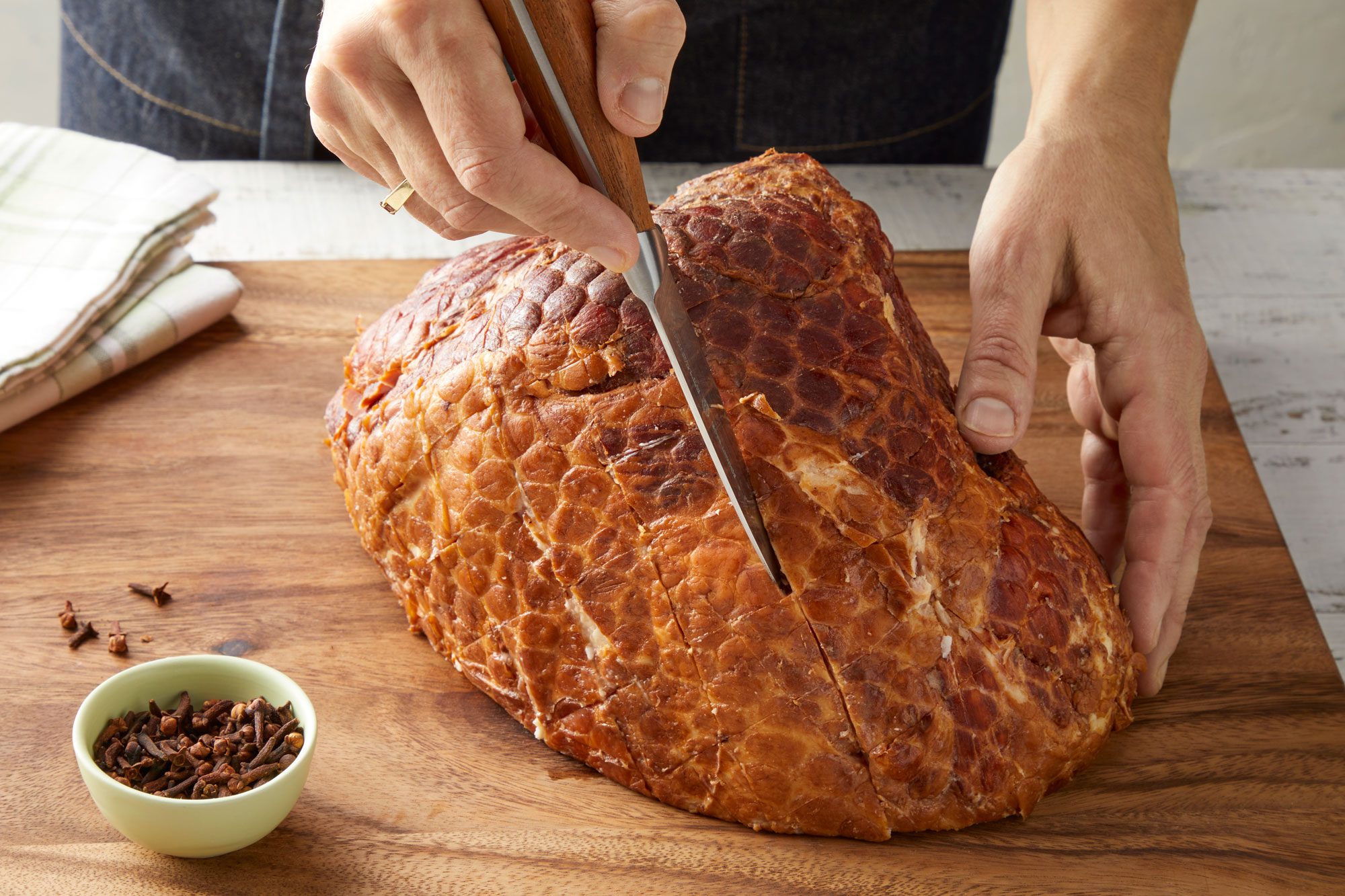 Cut side down of ham on a rack