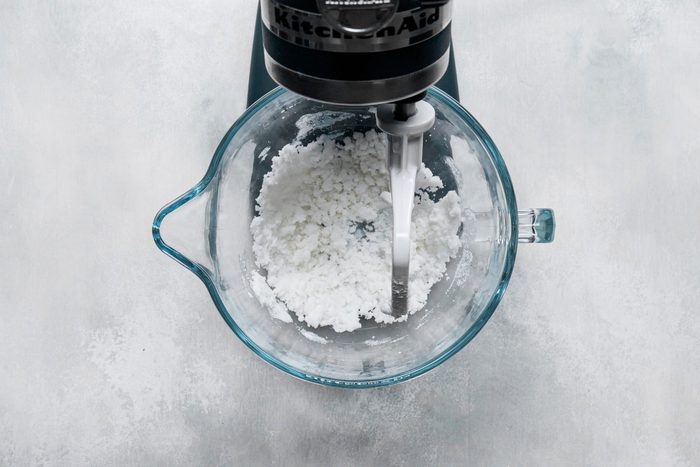 Shortening and sugar blended together in a large bowl with a stand mixer