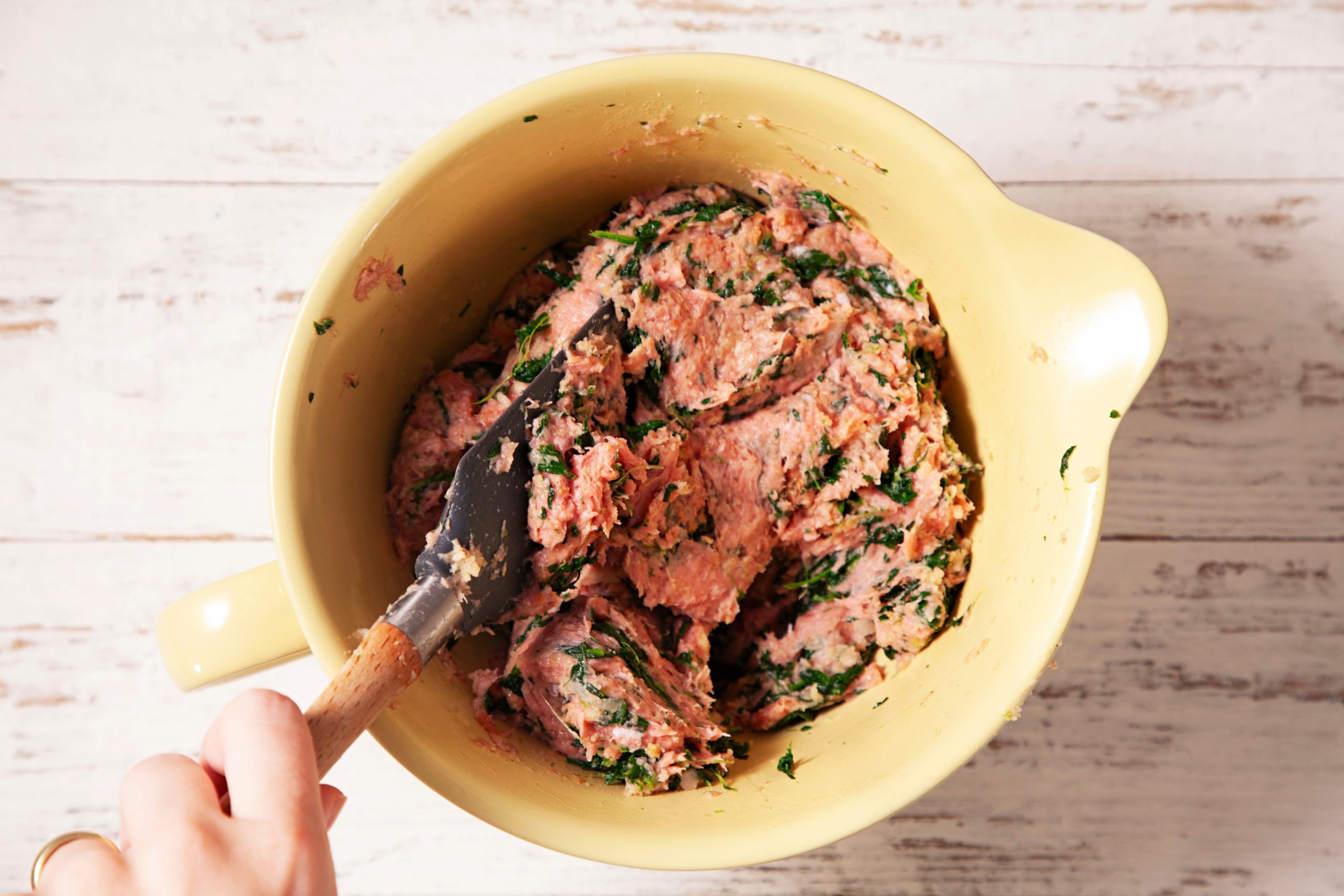 mixing turkey in spinach mixture