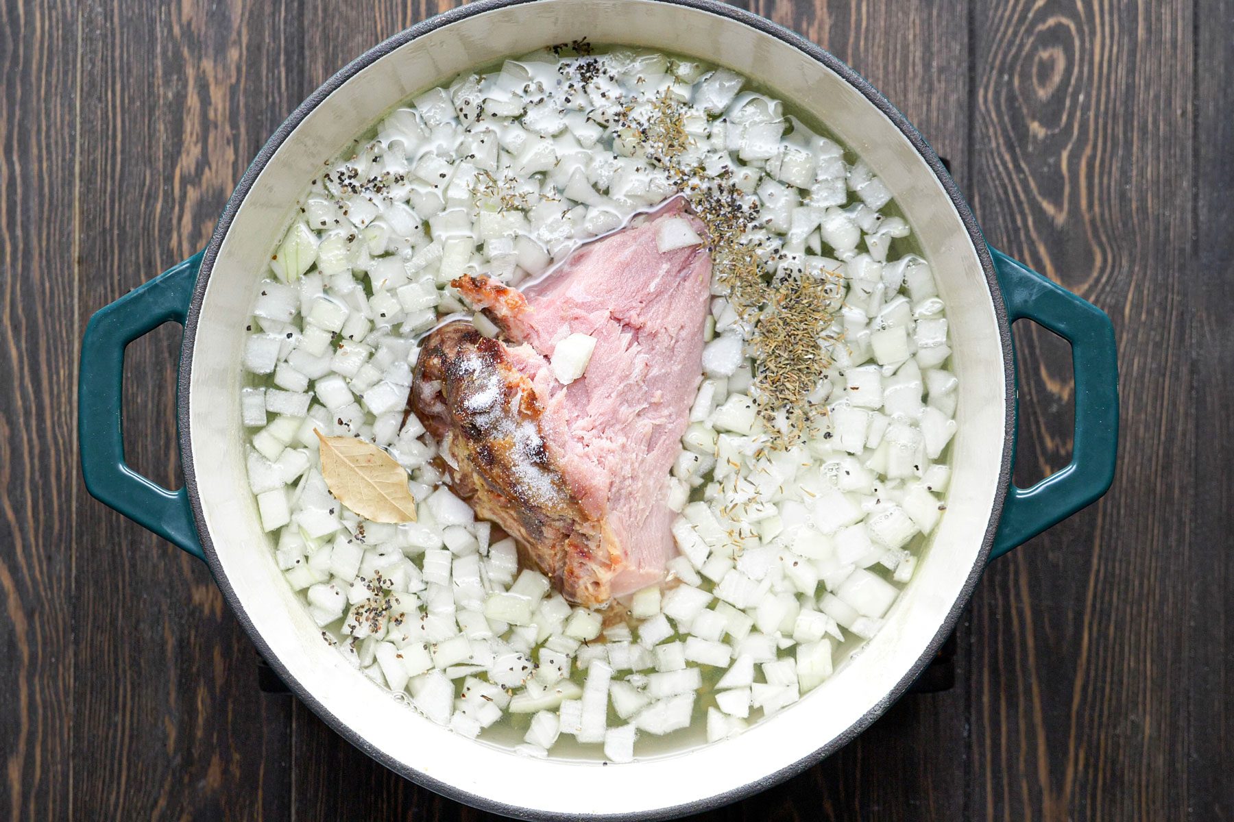 Ham bone, onion, salt, pepper soaked in water in a large pan