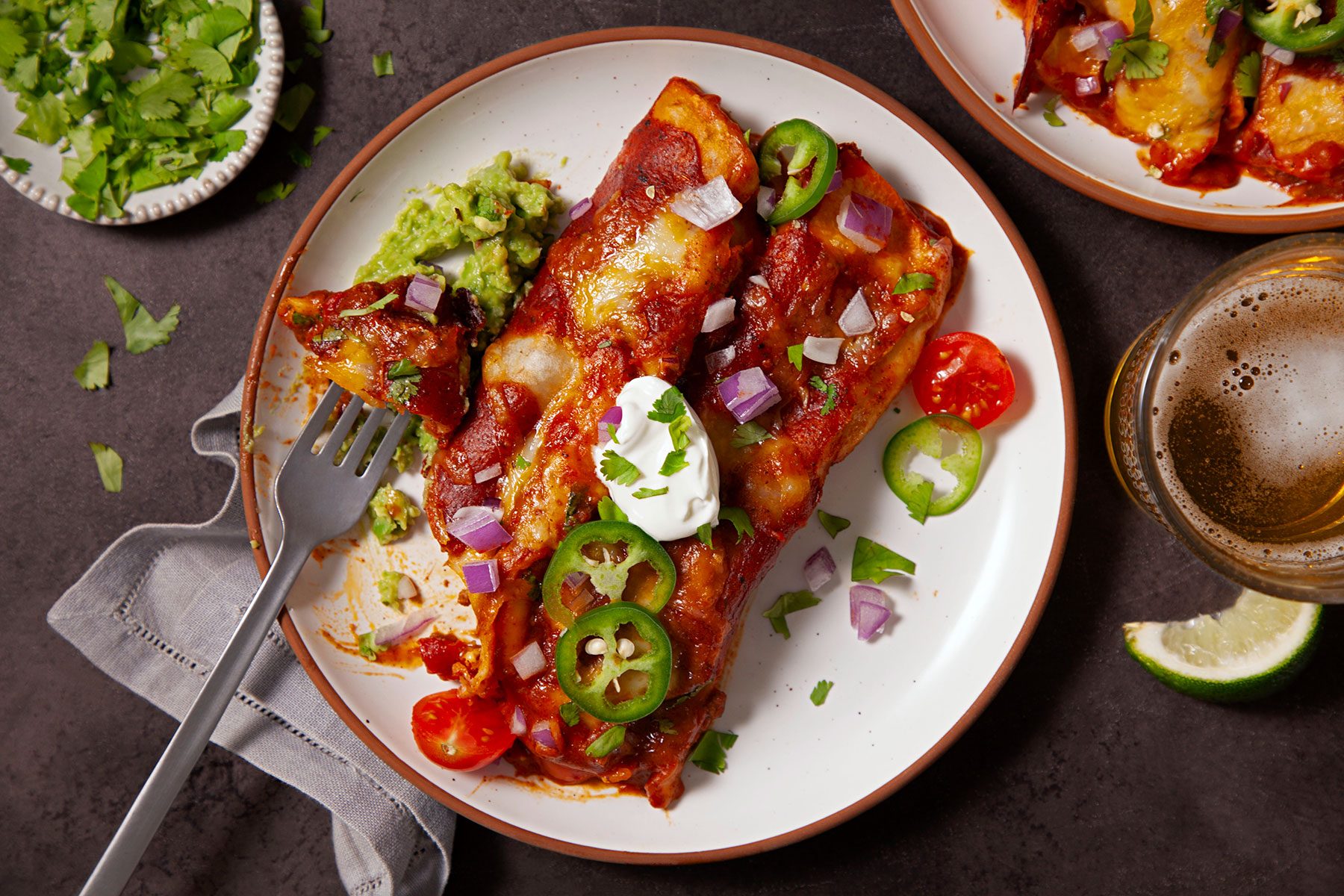 Served the Beef Enchiladas on a plate with toppings