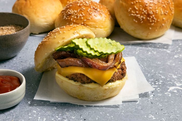 Hamburger with onions, cheese slice, patty and pickles