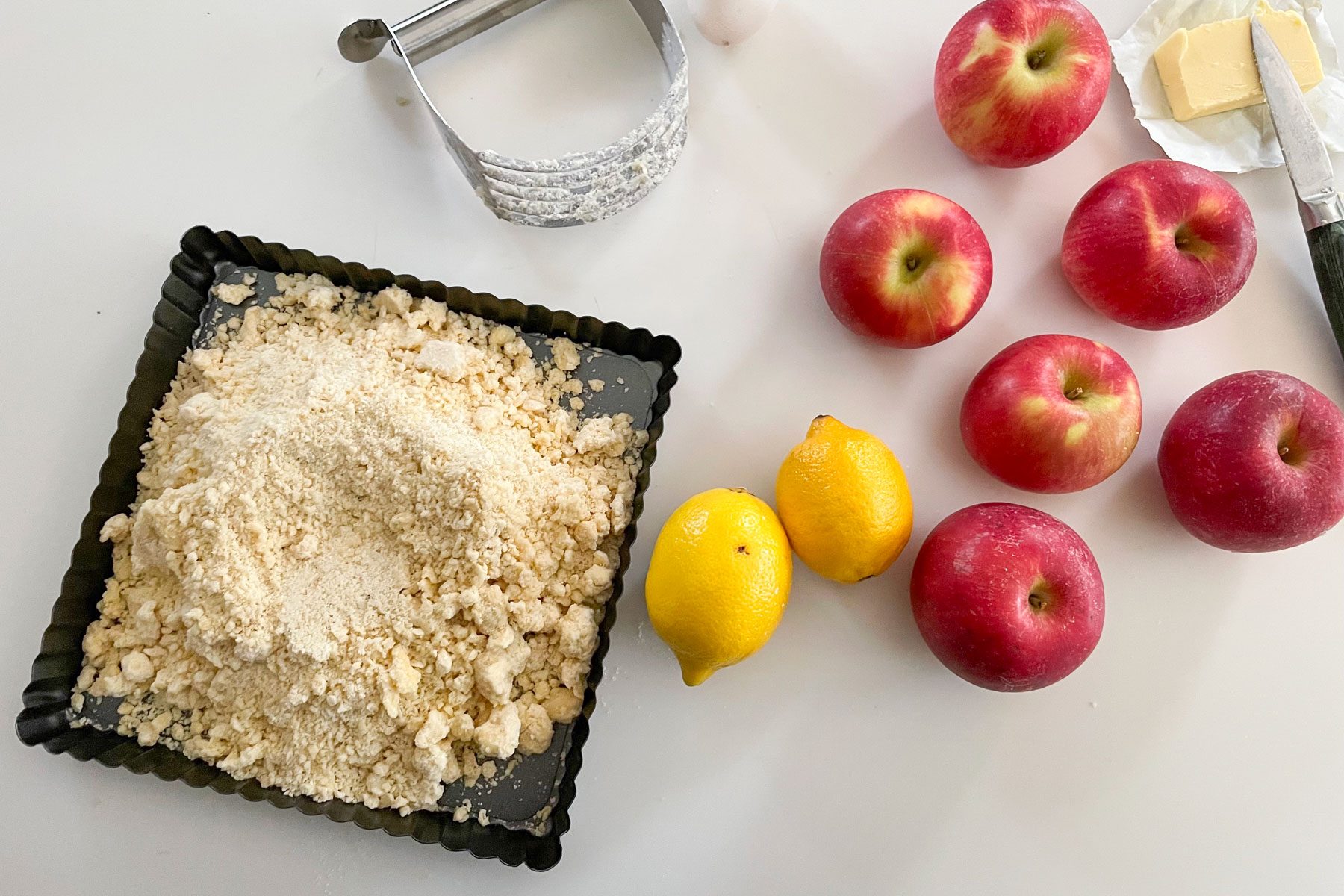 Almond flour apples lemon butter placed on a white table