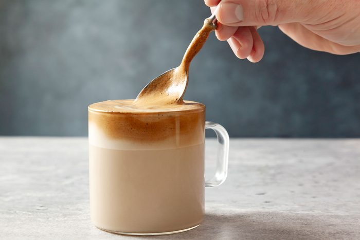 wide shot of coffee mixture mixed in the milk