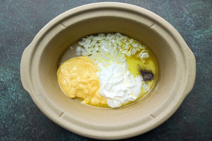 All ingredients for comforting cheesy potatoes in bowl