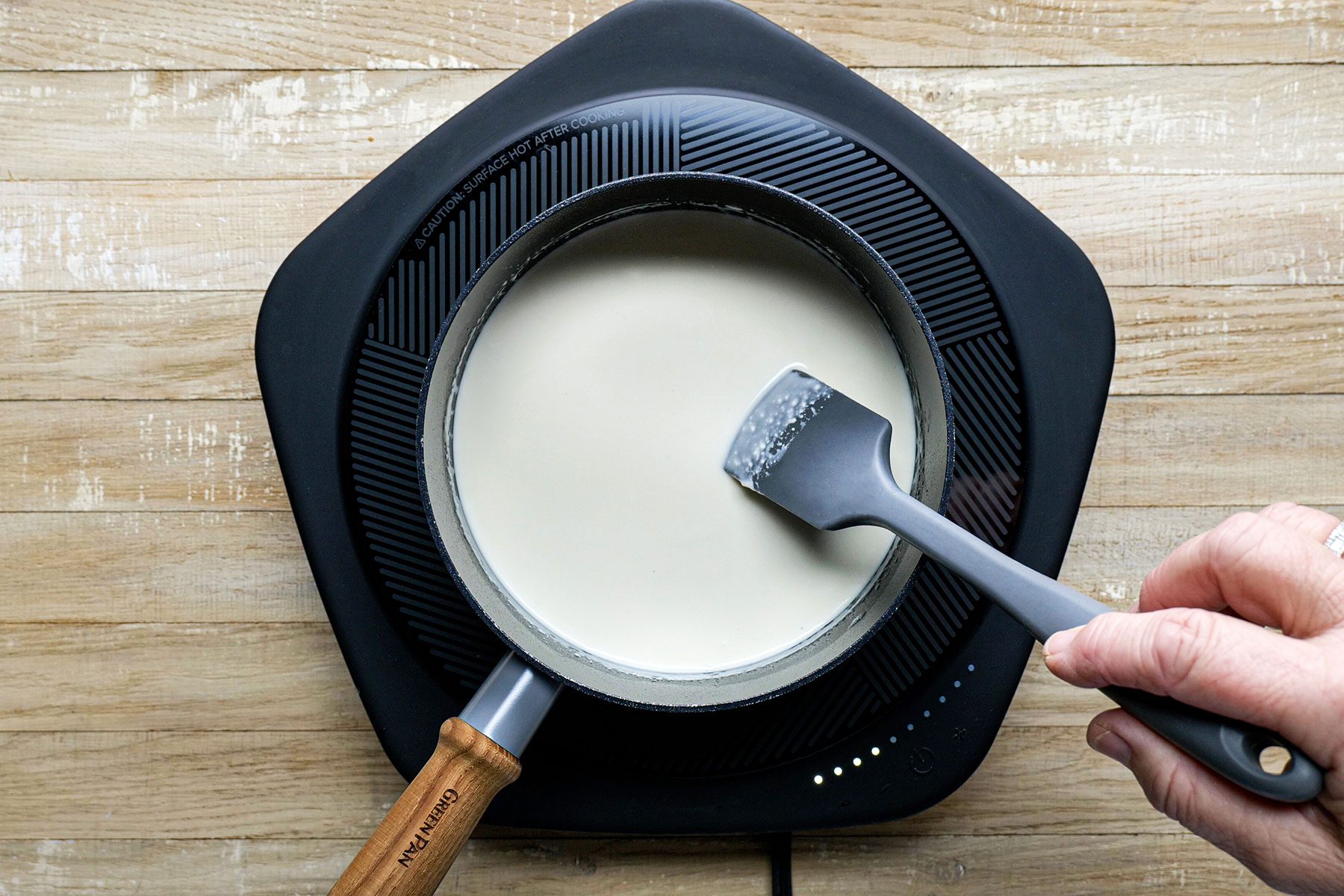 stirring liquid ingredient in saucepan