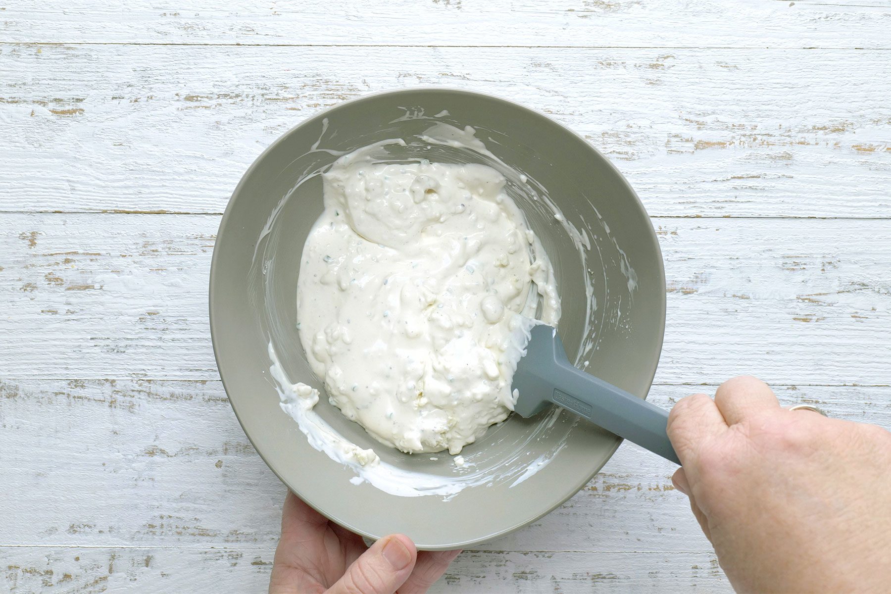overhead shot of blue cheese in a large bowl