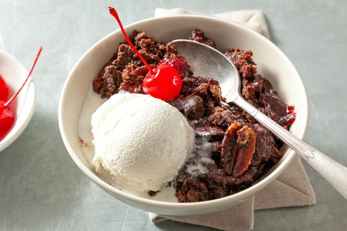 Chocolate cherry dump cake served with ice cream and cherry