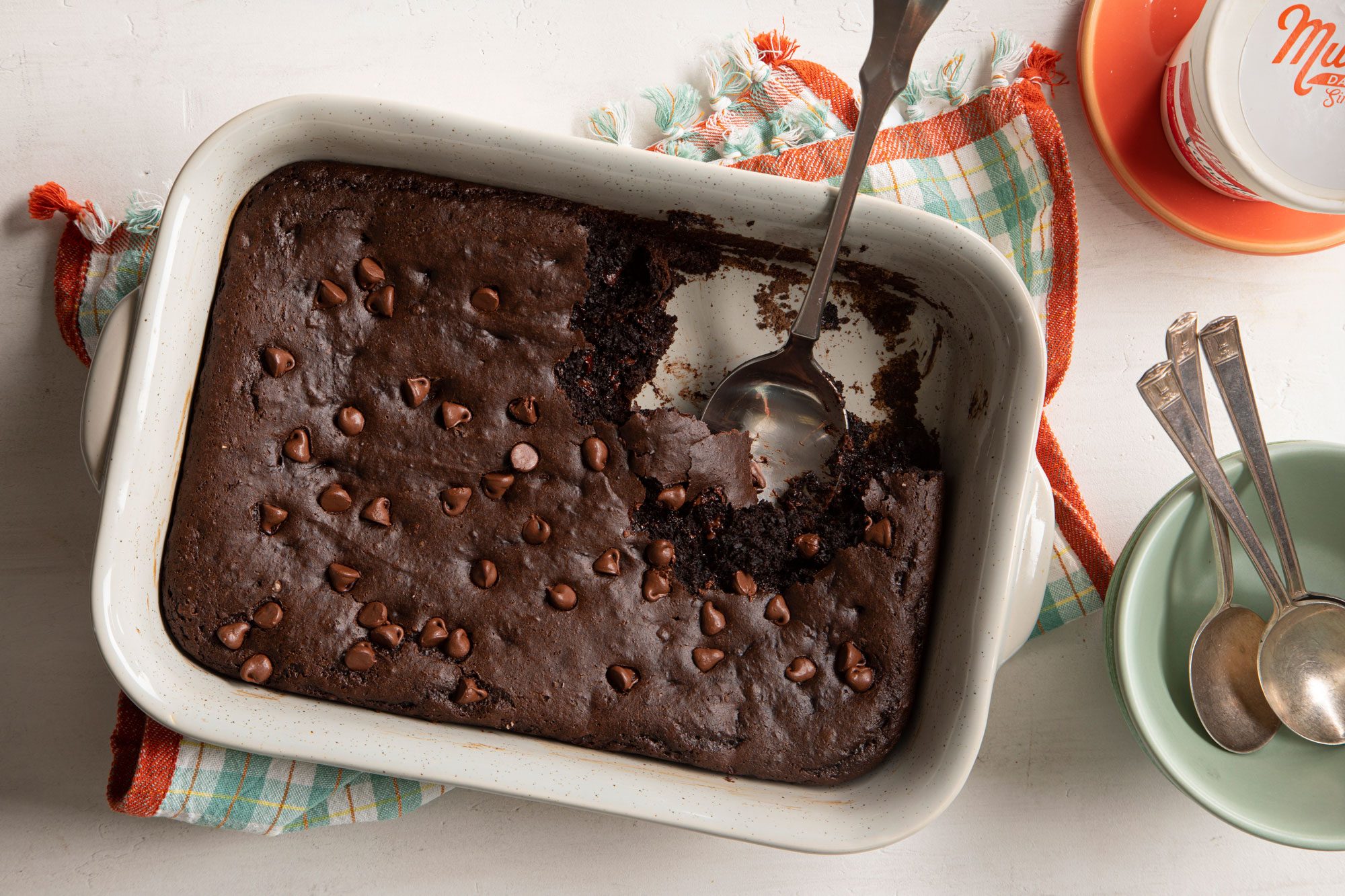 overhead shot of Chocolate Dump Cake and a spoon in a rectangular baking dish