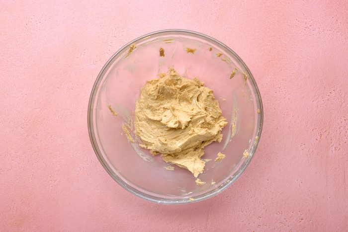 Combine peanut butter, confectioners' sugar, butter and salt