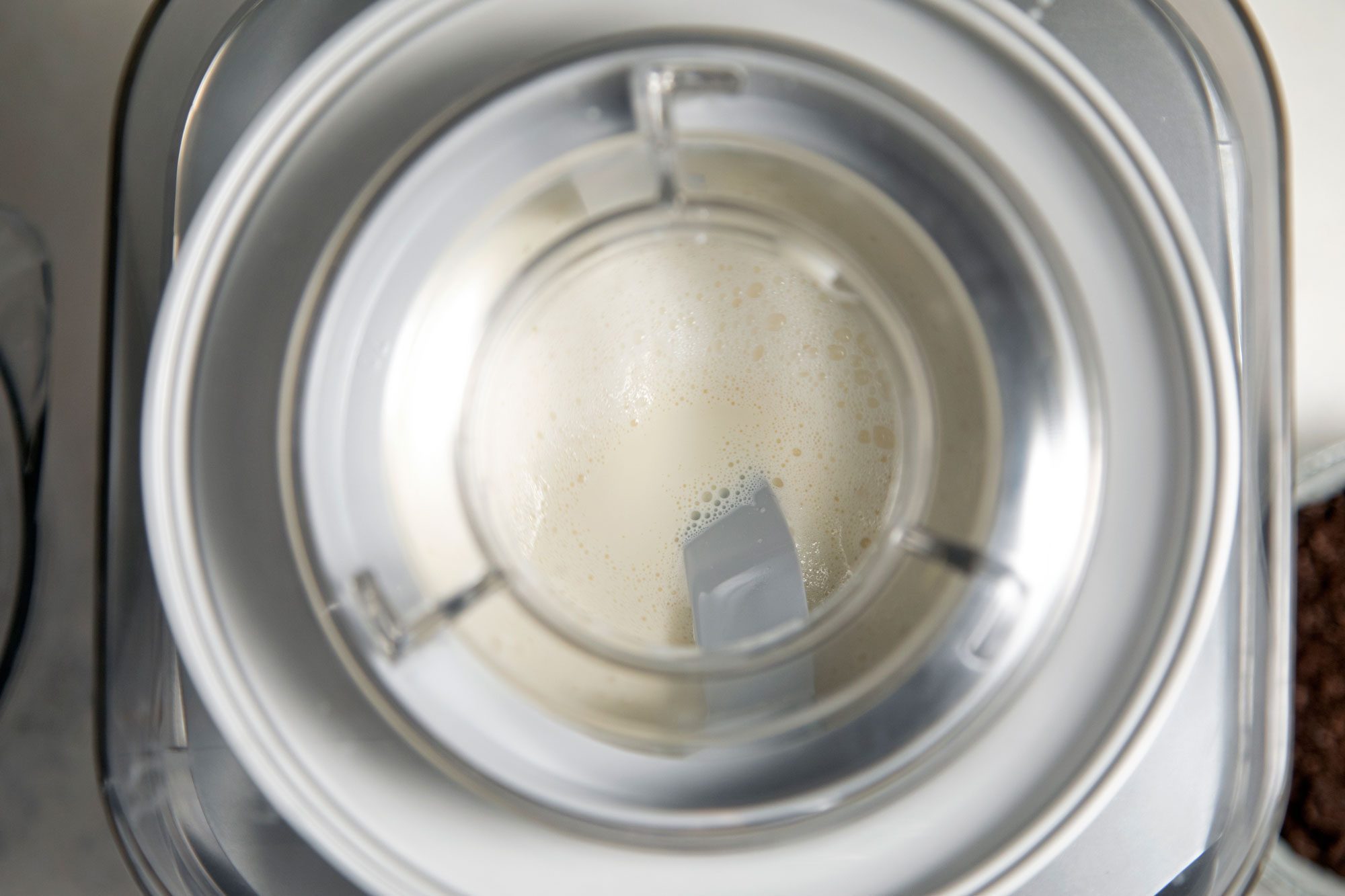 Fill cylinder of ice cream maker no more than two-thirds full