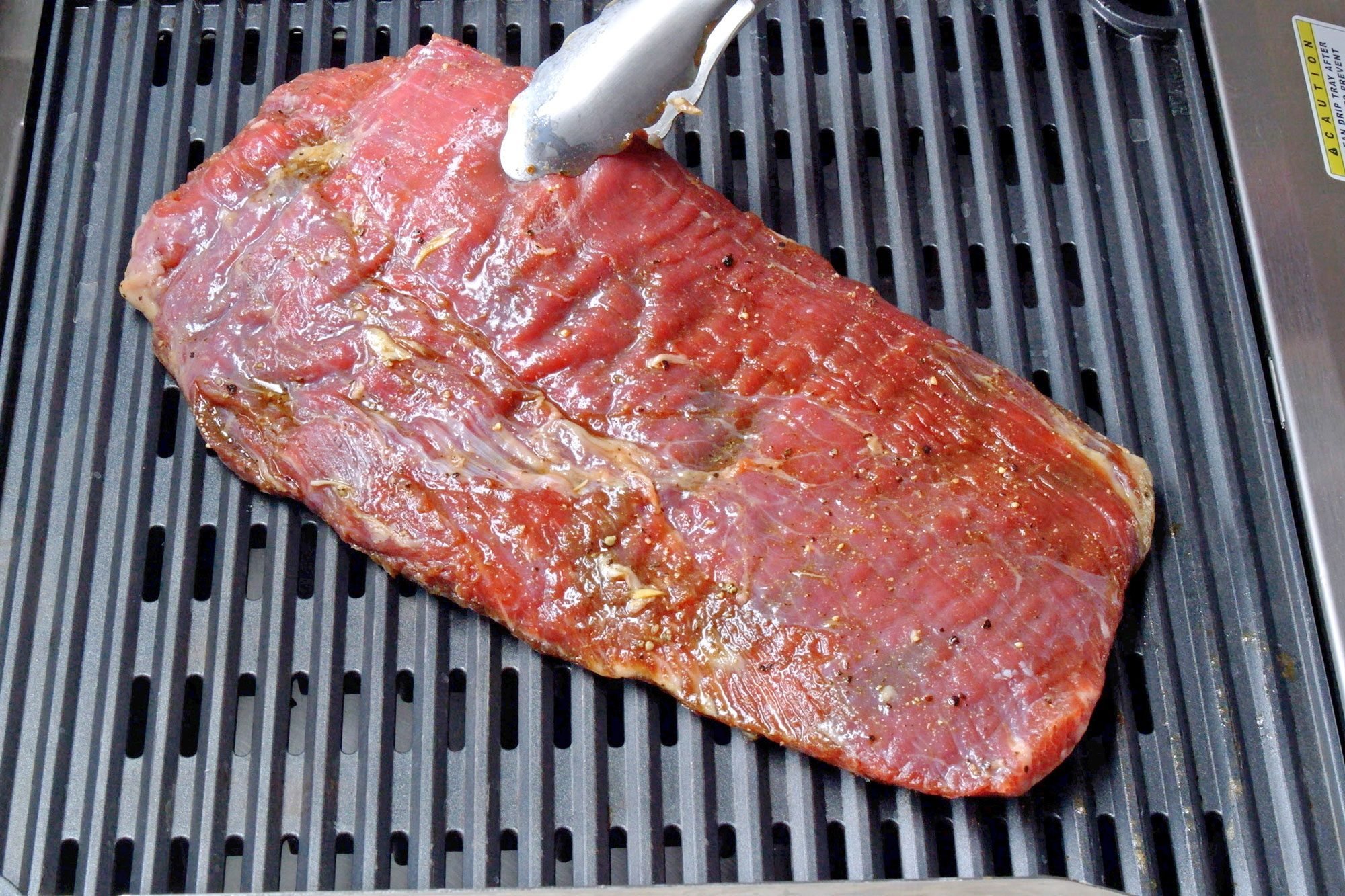 Grill the steak over medium-high heat for six to eight minutes on each side