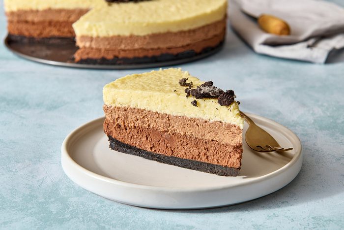 Closeup of a single piece of triple chocolate mousse cake